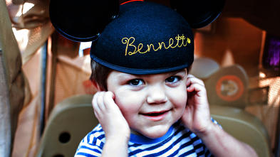 Bennett smiling in Mickey Mouse hat